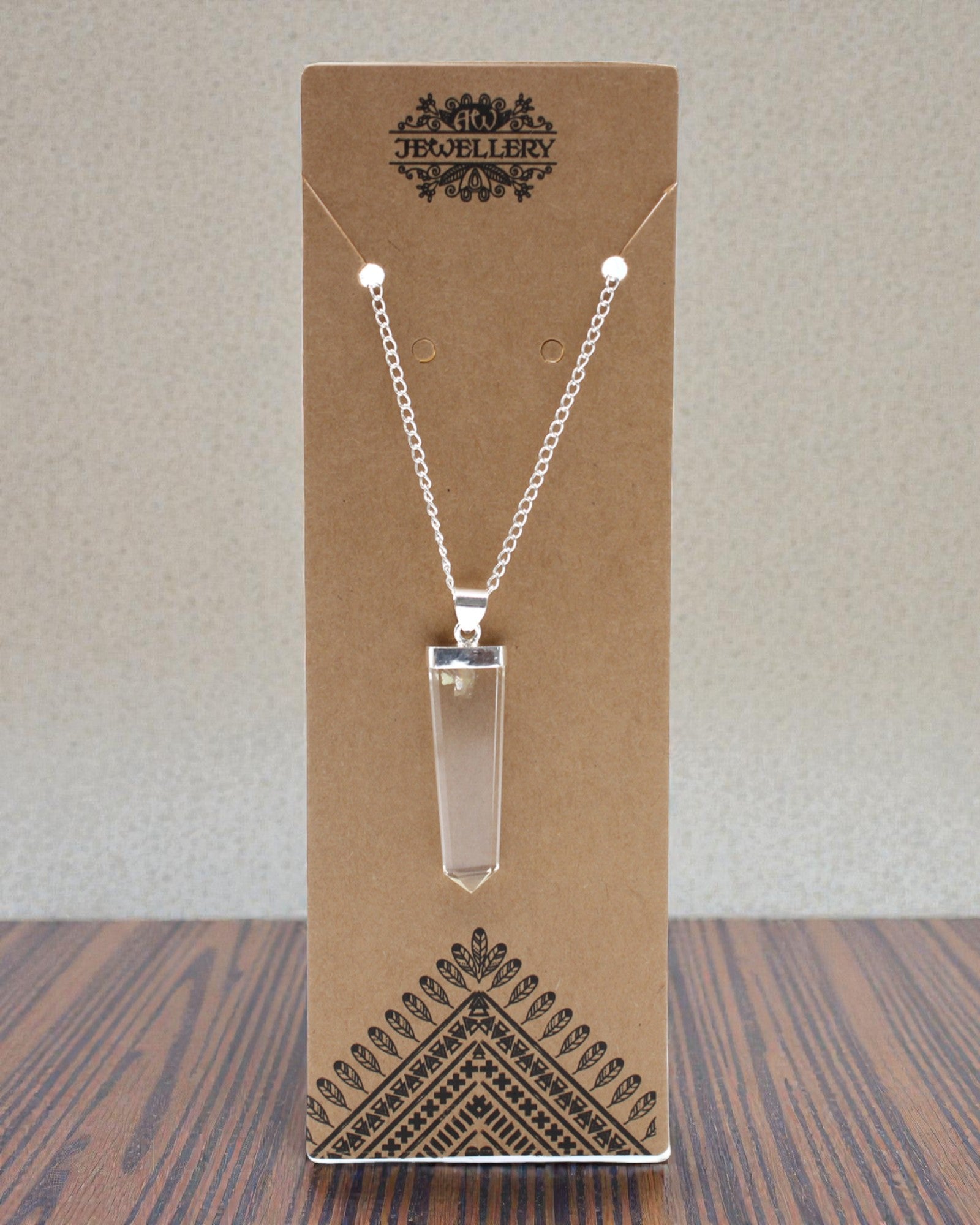 Kristallstrahl – Flacher Anhänger aus Bergkristall im Kristallschliff