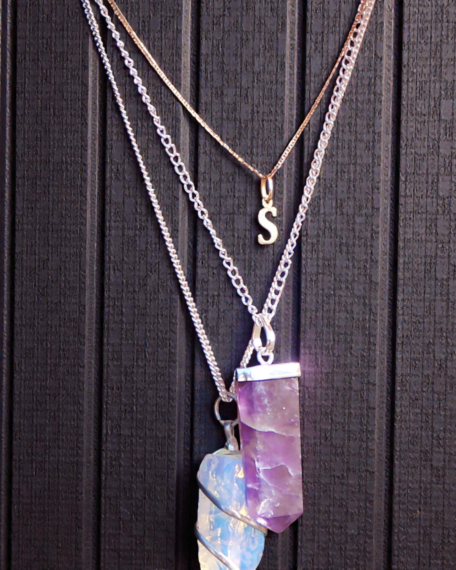 Kristallstrahl – Flacher Anhänger aus Bergkristall im Kristallschliff